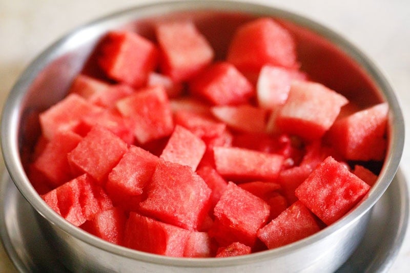 Chopped watermelon cubes in mixing bowl.