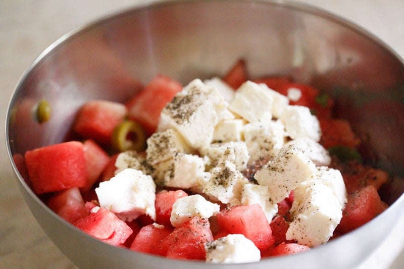 Watermelon and feta cheese salad sprinkled with seasonings.