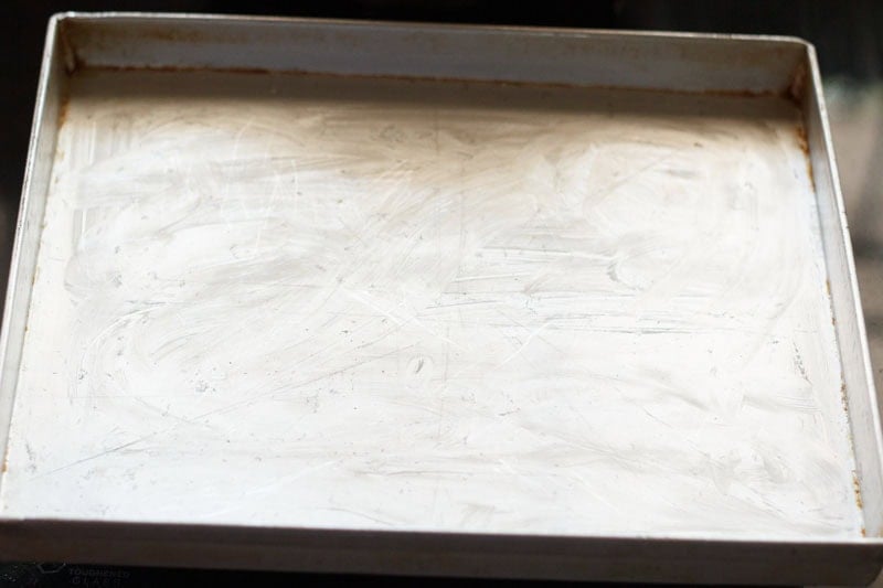 Baking tray greased with butter.