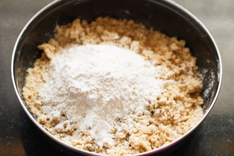 Powdered sugar added to mixed butter and wheat mixture.