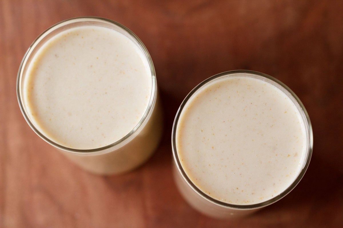 Two glasses of creamy kaju milkshake
