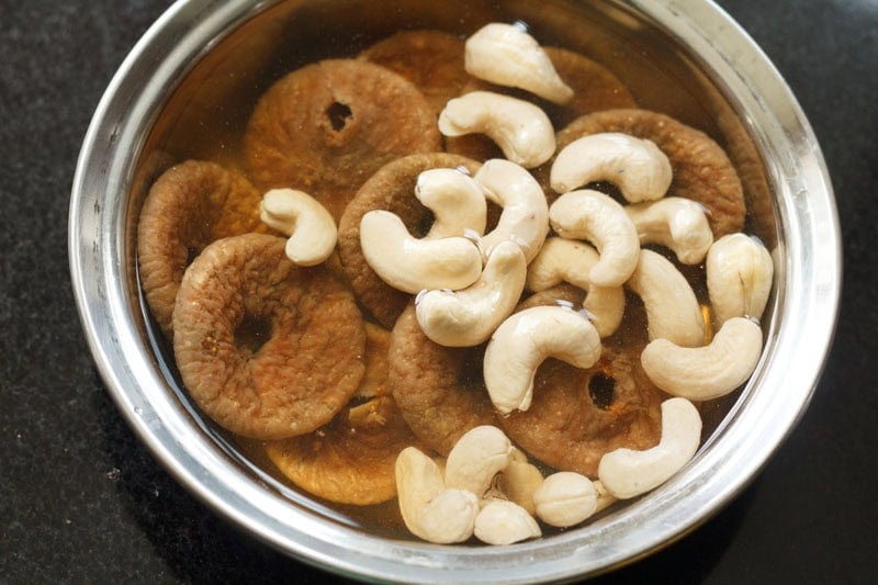 Soaked figs and cashews in bowl.