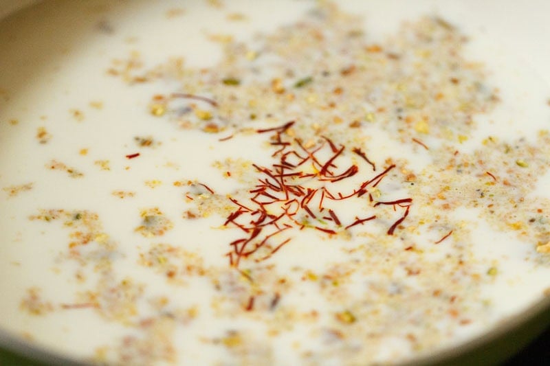 Crushed saffron strands in milk.