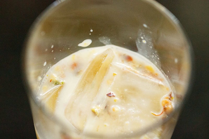 Saffron infused milk in glass.