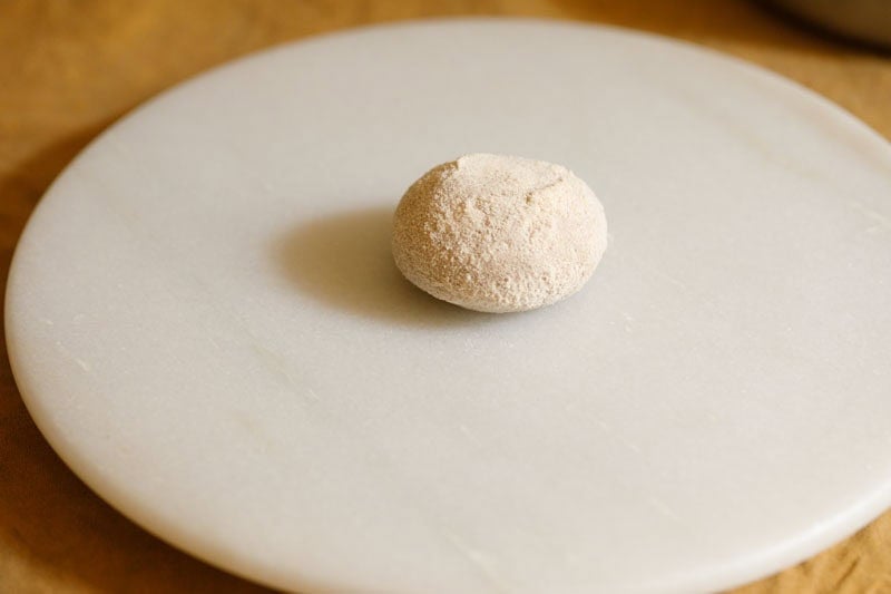 Dough ball on a marble surface.