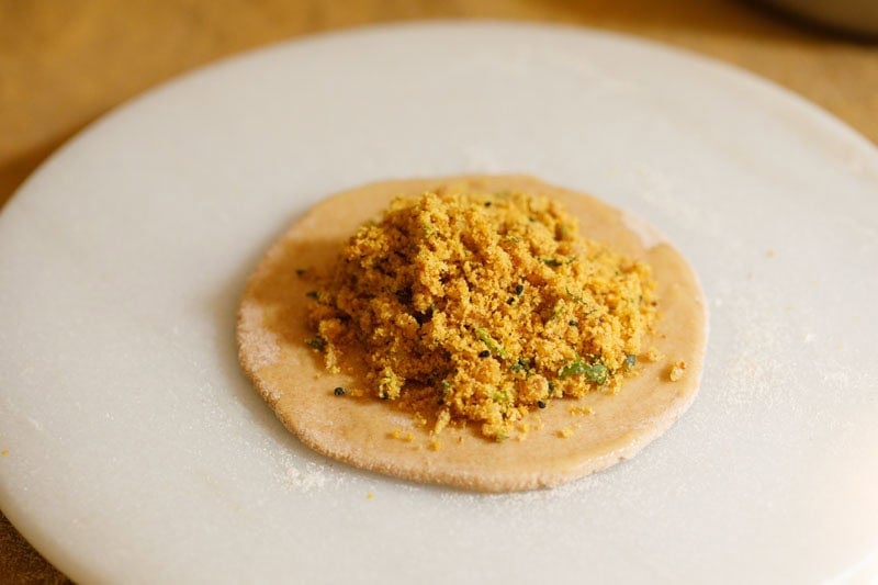 Rolled dough with sattu filling.