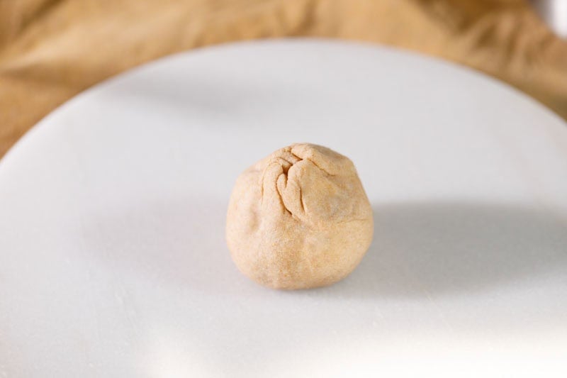 Stuffed dough on a flat surface.