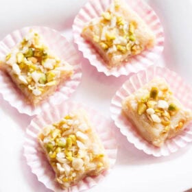 Malai Barfi on a white plate.