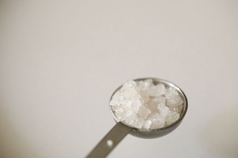 Salt crystals in measuring spoon.