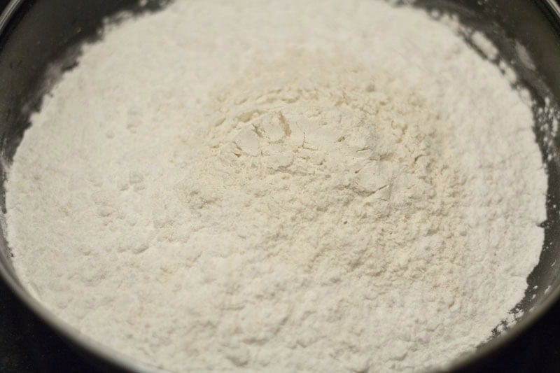 Urad dal flour and rice flour in bowl.