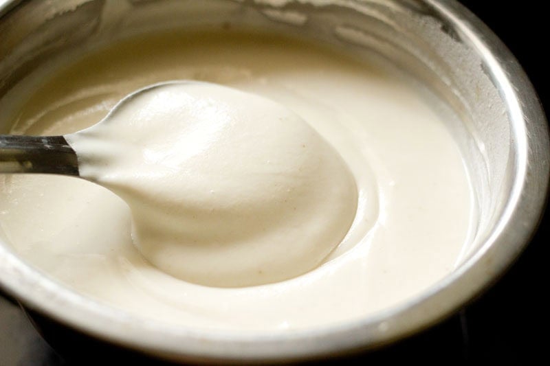 Fermented batter in a spoon.