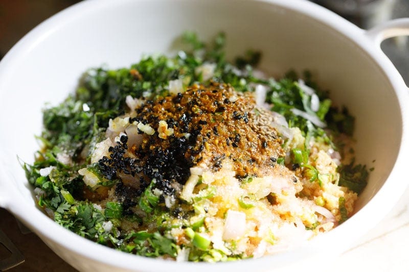 Bowl of mixed herbs, spices and mango pickle masala.