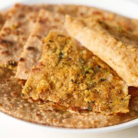 Sattu paratha with spiced sattu filling stacked.