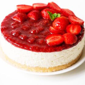 Strawberry cheesecake on white plate.