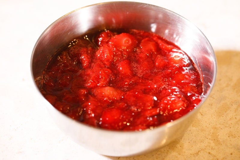 Strawberry coulis in a bowl.