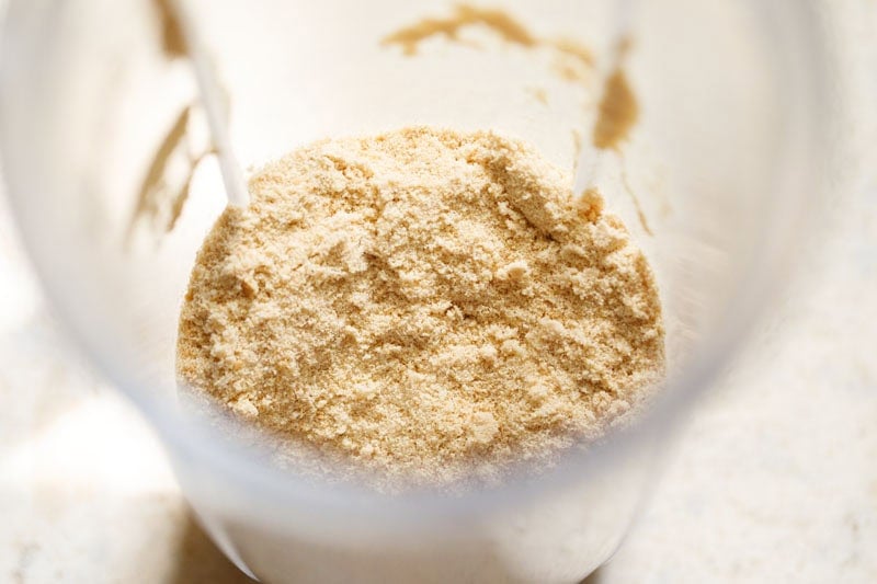 Finely crushed or powdered cookies in blender cup.