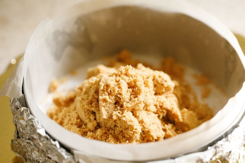 Cookie and butter mixture in springform pan to make cookie layer.