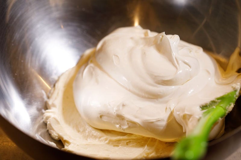 Whipped cream added to whipped cream cheese mixture.