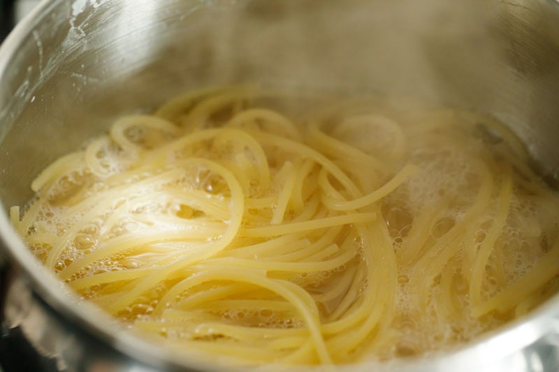 Cooking spaghetti in boiling water.
