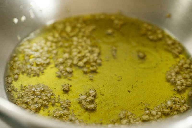 Garlic sizzling in olive oil.