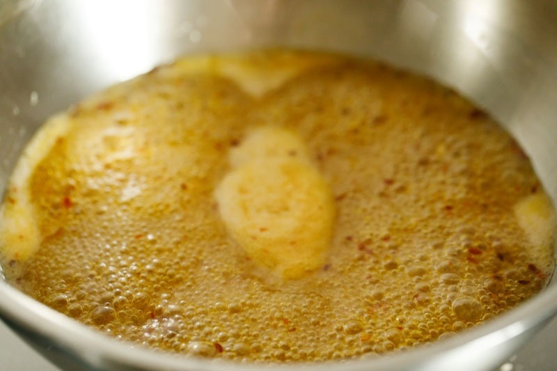 Bubbling mixture in pan.