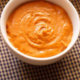 Onion tomato chutney in a bowl.